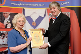 David Court, Court on Camera receiving his Honorary Fellow membership certificate from the Chairman of Essex County Council, Councillor Elizabeth Hart at the County Hotel, Chelmsford