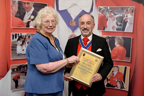 David Court, Court on Camera receiving his Honorary Fellow membership certificate from the Chairman of Essex County Council, Councillor Elizabeth Hart at the County Hotel, Chelmsford