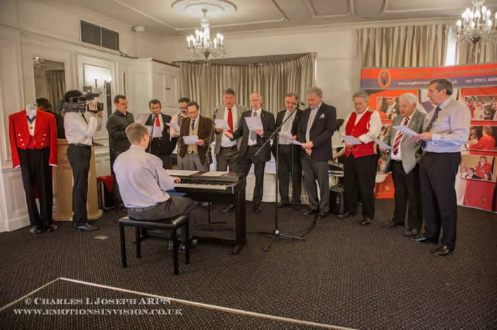 English Toastmasters Association choir practice for the Masonic Ladies Song.