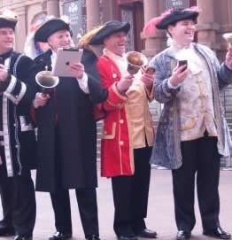 Town Criers form the English Toastmasters Association ringing the changes for new methods of communications.