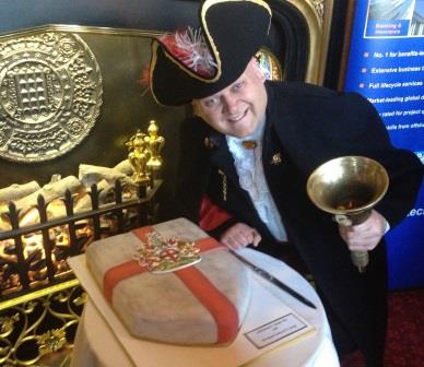 The St. George's Day Celebration Cake being carefully looked after by Jim Cattermole