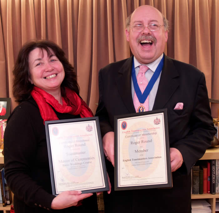 Toastmaster Roger Round receiving his training certificates from Linda Palmer, founder member of the English Toastmasters Association