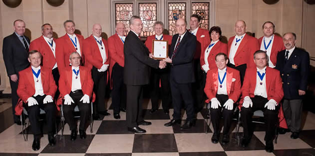 Hon. Fellow of the English Toastmasters Association, Patrick Stevenson, receiving his fellowship certificate from the Lord of the Manor of Romans Fee, Writtle, Essex, Richard Oscroft MBE