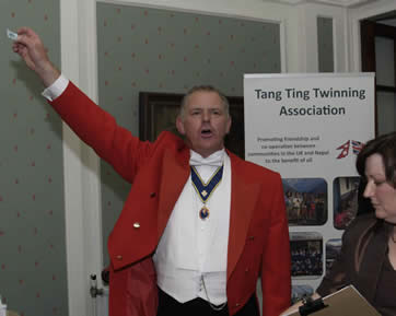 Kent Toastmaster Jude Garland working in Essex helping the Tang Ting Twinning Association with the raffle