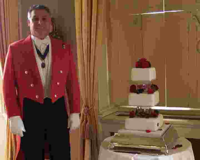 Toastmaster ready for the wedding cake cutting ceremony at Down Hall, Essex
