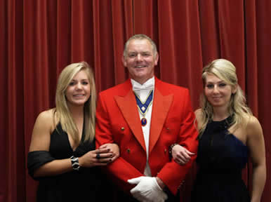Toastmaster Jude Garland with two assistants at the Tain Ting Twinning Association charity dinner