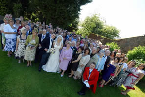 English toastmaster Eric Jones photographed with the bride and groom and their wedding guests